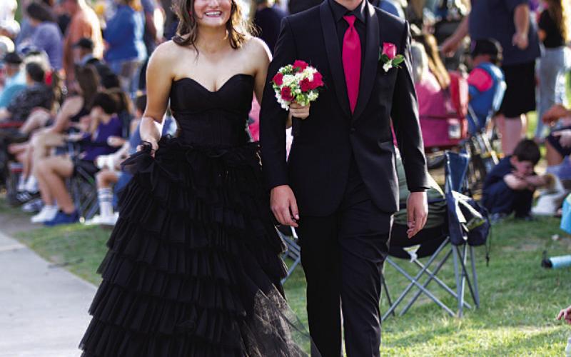HUNTER KING | DISPATCH RECORD At left, Paige Rutland and Hagan Davis make their way to the W.M. Brook Park suspension bridge.