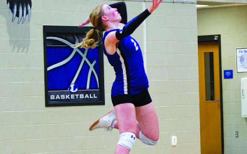 Ellie Felkner jumps to serve against Salado last Friday. HUNTER KING | DISPATCH RECORD