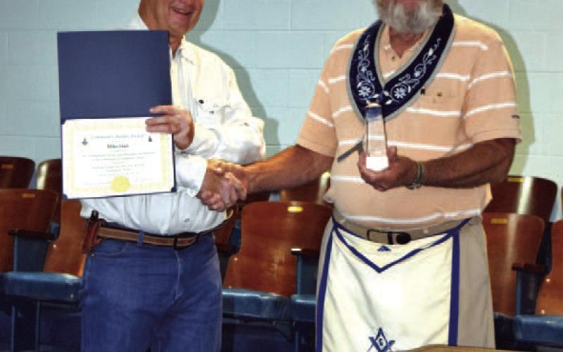Mike Hail, at left, was presented the Community Builder Award by Saratoga Masonic Lodge. He is shown with Lodge Master Tommy Thogmartin. COURTESY PHOTO