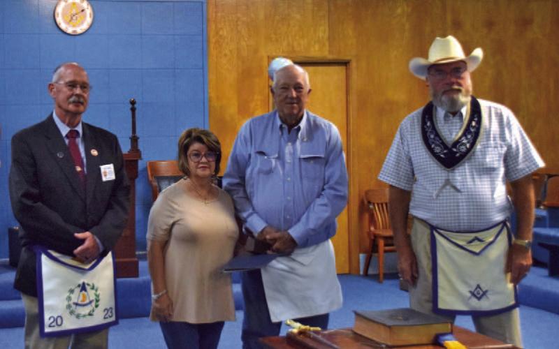 Saratoga Masonic Lodge presented its Golden Trowel Award to Randy Lake, in center, for his years of service as a Mason. Pictured are, from left, Kelly Tyson, Lori and Randy Lake, and Lodge Master Tommy Thogmartin. COURTESY PHOTO