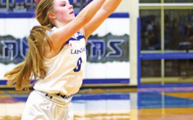 HUNTER KING | DISPATCH RECORD Addison Borchardt follows through on a three-point shot. The freshman played every minute against the Lady Cougars.