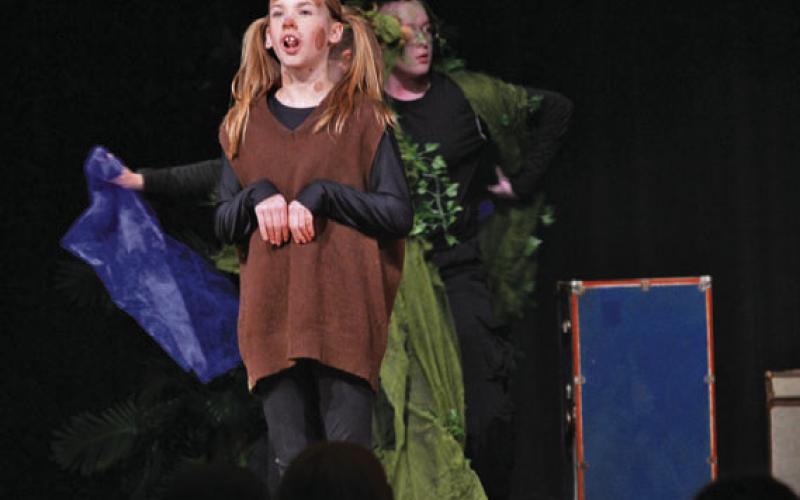Front and center, Ezra Allison performs her role as the “dog” in Lampasas Middle School’s rendition of “Wiley and the Hairy Man.” ERICK MITCHELL | DISPATCH RECORD