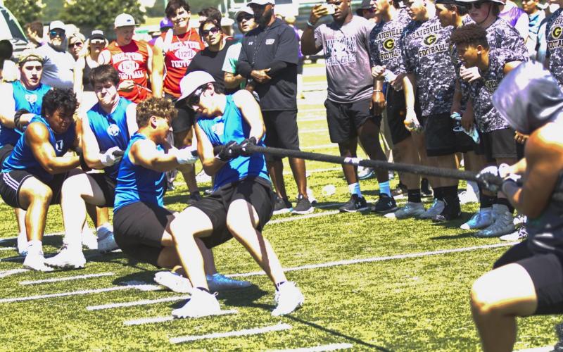 Badger football players compete in tug-of-war at a LIneman Challenge in Burnet on Friday on their way to winning the overall competition in Division II. Pictured, left to right, are Conner Keele, Sosa Sokimi, Michael Neary, Josh Carter and A.J. Torrez. Nick Torrez also competed and is shown in a separate group photo on page 6. JEFF LOWE | DISPATCH RECORD