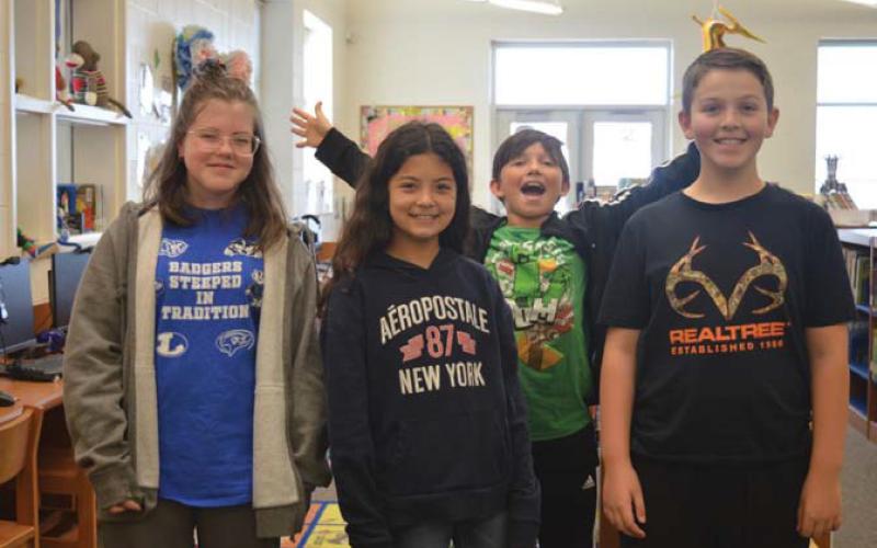 Taylor Creek Elementary School students, left to right: Raegan Brown, Gabriella Correa, Matthew Ruehlen and Gentry Barber. erick mitchell | dispatch record