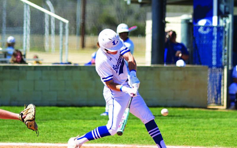 Timber Gholson swings at a pitch. He picked up three hits in Tuesday’s home game. HUNTER KING | DISPATCH RECORD