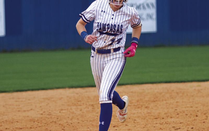 HUNTER KING | DISPATCH RECORD Aspen Wheeler sticks out her tongue as she rounds the bases following her two-run home run in game two of the bi-district playoff round.