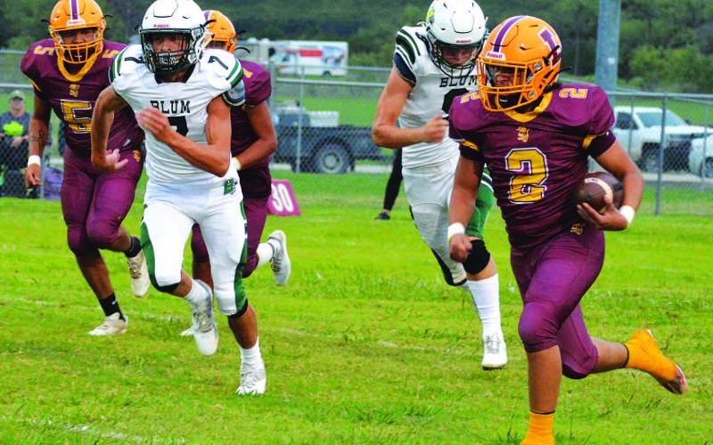 Elijah Gonzales (5) and Matthew Surber (4) are in on a tackle for loss. MASON HINES | DISPATCH RECORD
