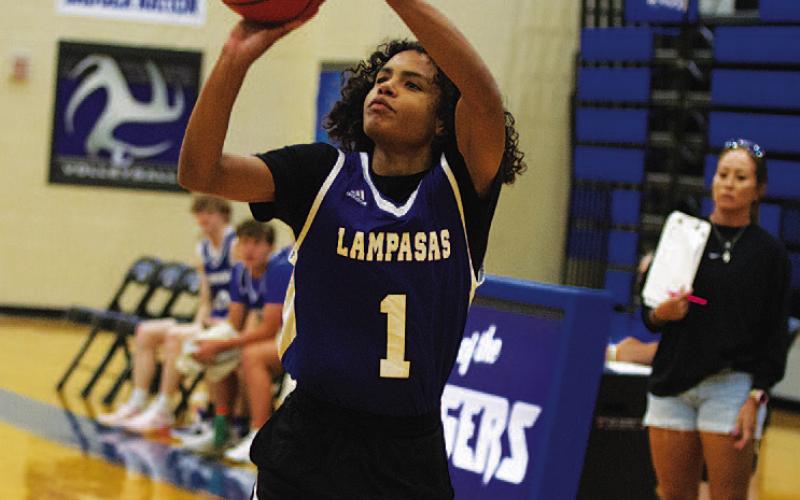 HUNTER KING | DISPATCH RECORD Angel Scott releases a three-point shot from the left wing.