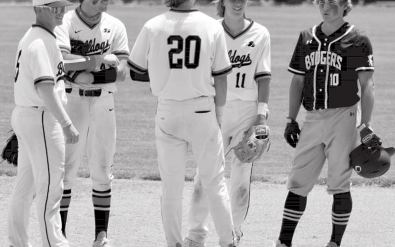 During a pitching change, the Burkburnett infield stops by second base to talk with Ace Whitehead after one of the last at-bats of his high school career. JEFF LOWE | DISPATCH RECORD