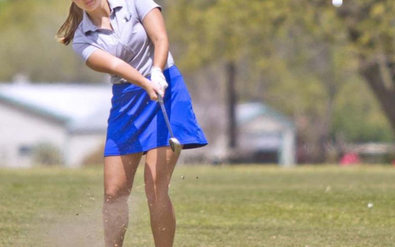 Shaylee Wolfe hits an approach shot at Gatesville Country Club on Monday. JEFF LOWE | DISPATCH RECORD
