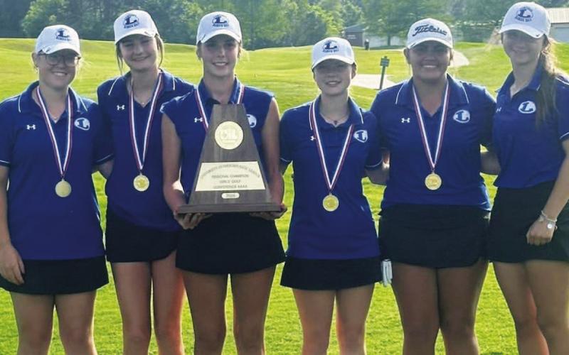 The Lady Badger golf team shows off their trophy and medals from winning the regional golf tournament last week. COURTESY PHOTO | LAMPASAS HIGH SCHOOL FACEBOOK