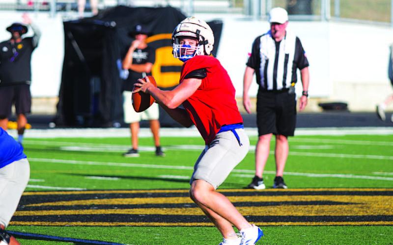 HUNTER KING | DISPATCH RECORD Reed Jerome prepares to throw the ball toward the sideline early in last Friday’s contest.
