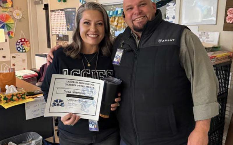 Named an October Teacher of the Month was Sara Bumpas, who teaches multiple agriculture classes at the high school and middle school. Pictured with her is Assistant Principal Ryan Race, who said Bumpas “connects with all her students in a positive and professional manner and holds them to a very high standard.” COURTESY PHOTO