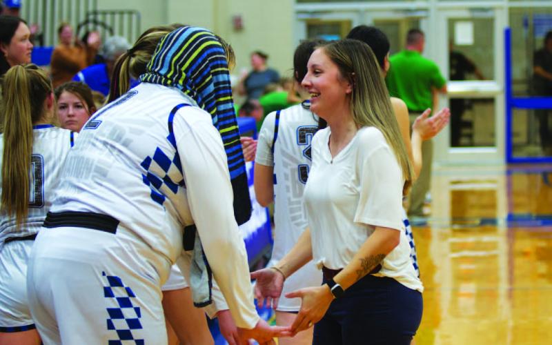 Lovejoy, left, and coach Macey Wooten celebrate after the 20-point win over Burnet. HUNTER KING | DISPATCH RECORD