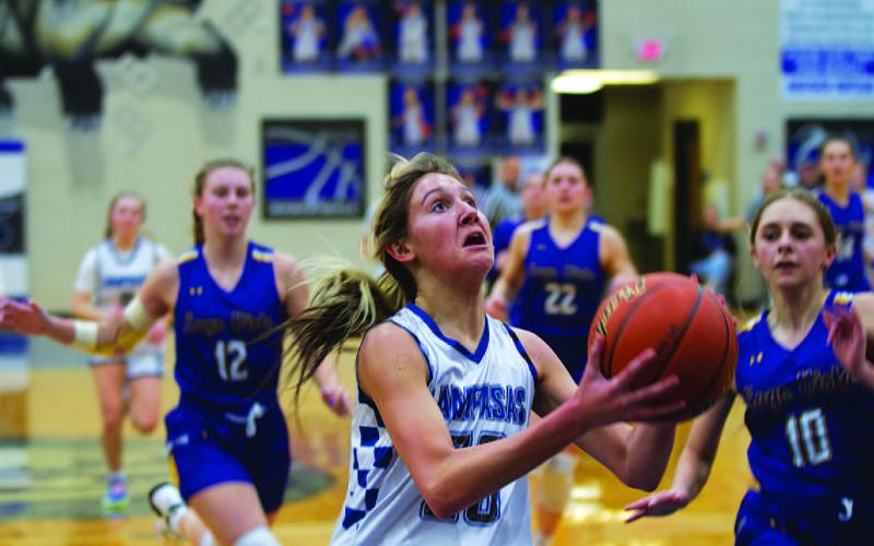 Girls’ basketball team battles for win over Lago Vista