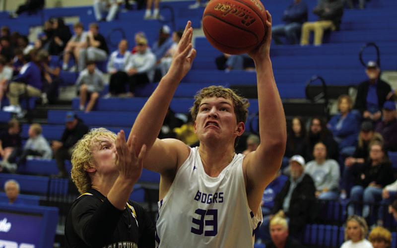 HUNTER KING | DISPATCH RECORD Beau Patterson fights through contact to finish at the rim against the Goldthwaite Eagles.