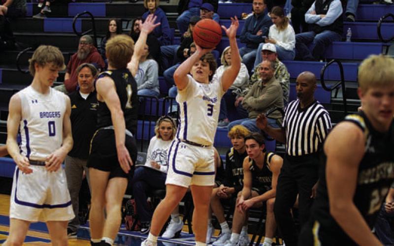 HUNTER KING | DISPATCH RECORD Aidan Nuckles shoots over an outstretched defender.