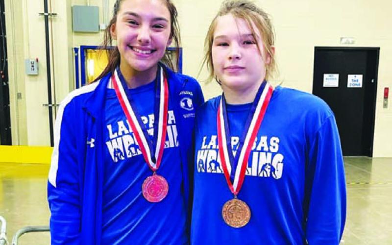 COURTESY PHOTO | LAMPASAS WRESTLING Charlie Freese, left, and Taylor Martell pose with their medals.
