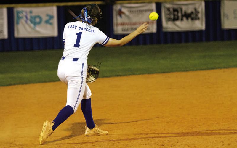Gia Grasso turns to throw to second base in the Lady Badgers’ district opener on Tuesday. HUNTER KING | DISPATCH RECORD