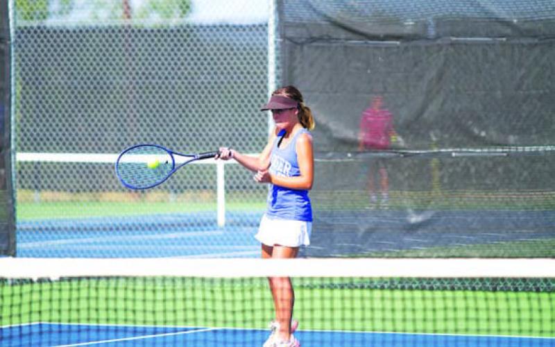 Sam Lopez hits a forehand shot during a match earlier this season. HUNTER KING | DISPATCH RECORD