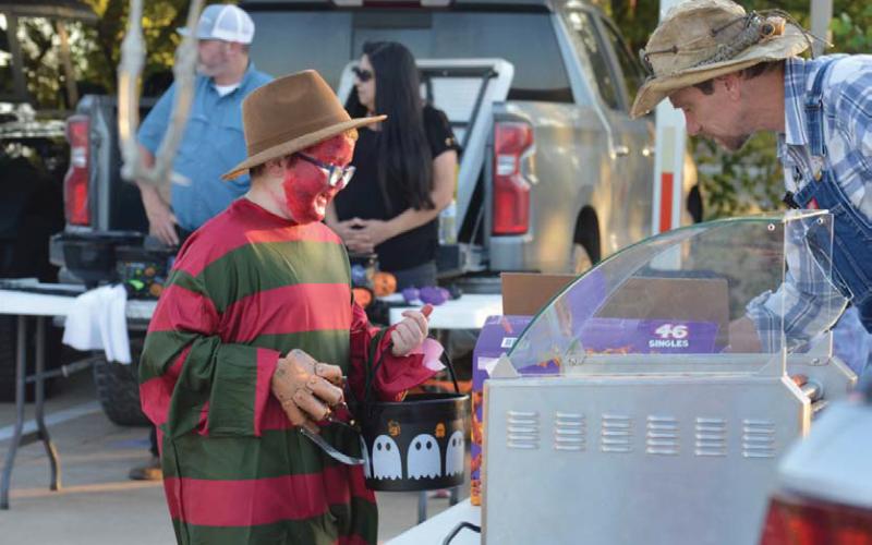Freddy Kreuger stops by for a hot dog during the city of Kempner’s annual Trunk or Treat event at City Hall. erick mitchell | Dispatch record