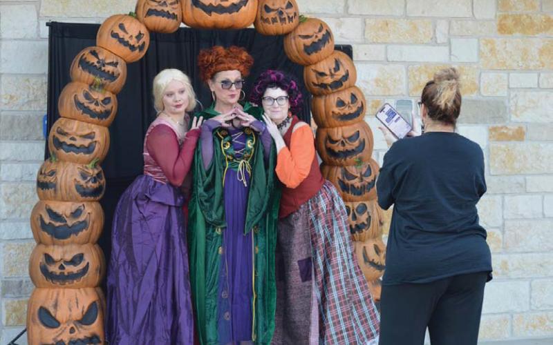 City staff Hayleigh Talasek, Rebecca Ramos and Keri McLane pose for a photo as the three witches from “Hocus Pocus” before Thursday’s Trunk or Treat event was underway. erick mitchell | Dispatch record