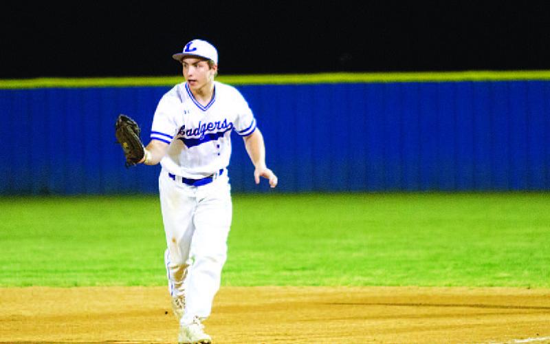 Dylan Peak takes a ground ball over to the first base bag for an out. HUNTER KING | DISPATCH RECORD