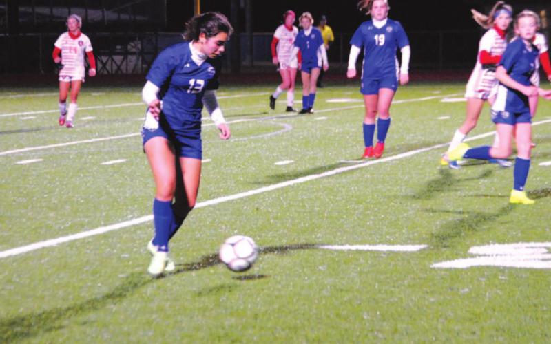 Tate Brown dribbles in the midfield and moves the ball up the field against the Salado Lady Eagles on Wednesday night. HUNTER KING | DISPATCH RECORD