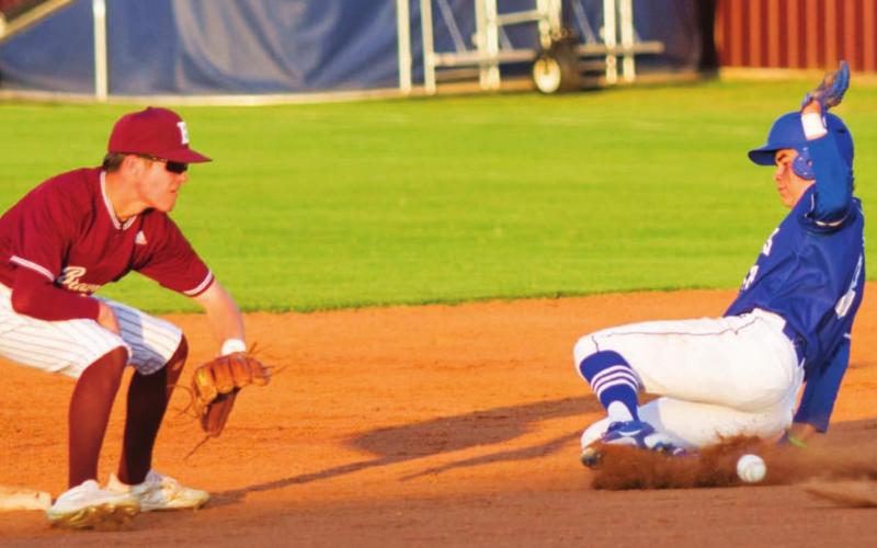 Tak Stinnett slides safely into second for a steal. Stinnett had three RBIs, and the Badgers cut a nine-run deficit down to three runs but lost Tuesday. JEFF LOWE | DISPATCH RECORD
