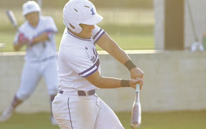 HUNTER KING | DISPATCH RECORD Eli Calderon takes a swing at an offspeed pitch.