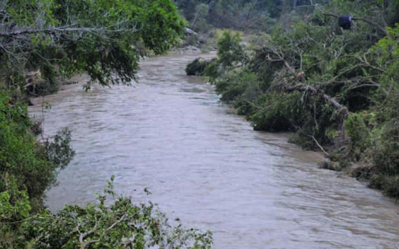 Rapidly moving water flows down the Lampasas River at the FM 1690 bridge after heavy rainfall upstream occurred the first weekend in May. FILE PHOTO
