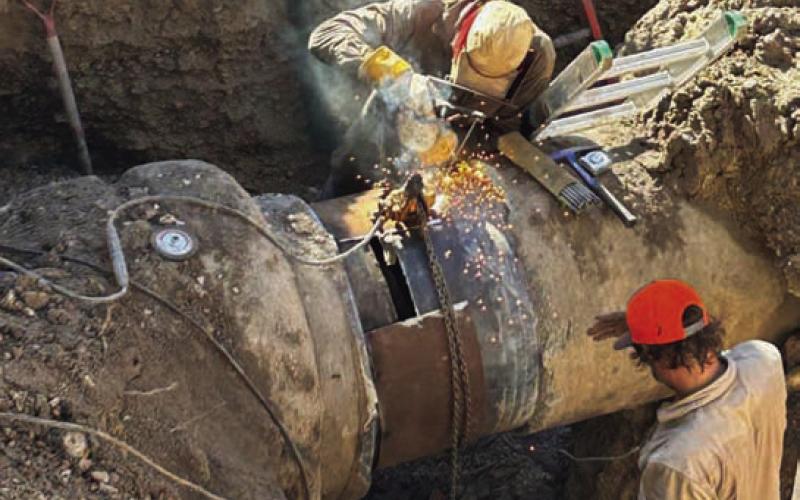 Welders work to repair the transmission line along U.S. Highway 190 at FM 2808, which affected water service to numerous customers in the Kempner and Lampasas areas. FILE PHOTO