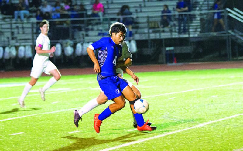 HUNTER KING | DISPATCH RECORD Juan Rodriguez fights with a Stephenville defender as he dribbles toward the goal.
