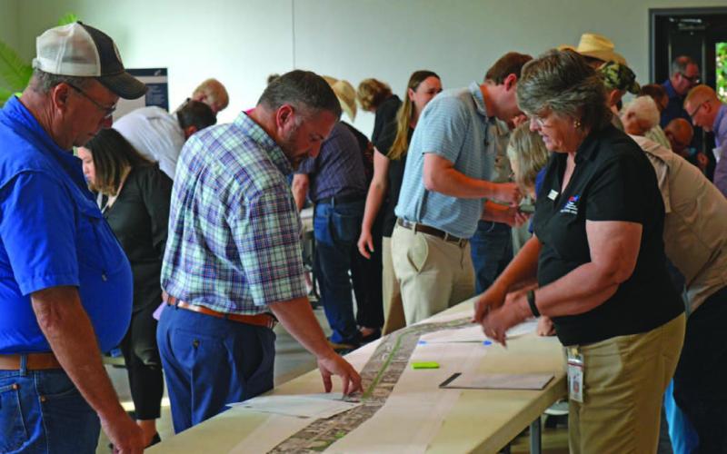 County residents speak with TxDOT officials before last week’s presentation on the U.S. Highway 281 Lampasas-to-Evant improvement project. ERICK MITCHELL | DISPATCH DISPATCH