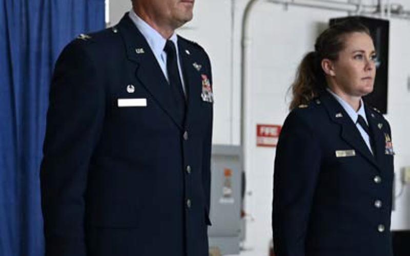 MASTER SGT. BARBARA OLNEY | U.S. AIR NATIONAL GUARD U.S. Air Force Lt. Col. Angi Daiuto, right, and Col. William McCrink III, commander of the 174th Attack Wing, stand at attention during her promotion ceremony at Hancock Field Air National Guard Base in New York.