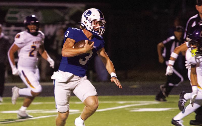 HUNTER KING | DISPATCH RECORD Reed Jerome runs past an Eagle defender for a rushing touchdown in last week’s game.
