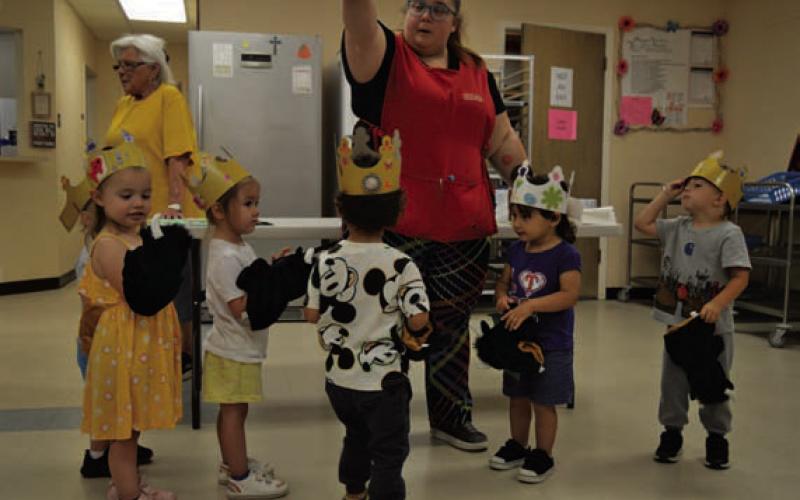 Lampasas Head Start children show off their crowns and puppets before receiving direction from staff. ERICK MITCHELL | DISPATCH RECORD