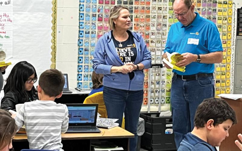 courtesy photo Putting dictionaries in the classroom The Copperas Cove Rotary Club donated dictionaries for every third-grade student at Taylor Creek Elementary School. Sarah Seidler and Tom Pursel, shown here, passed out the dictionaries and answered questions from students.