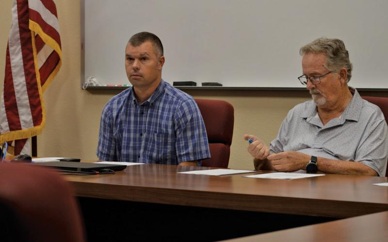 From left, Lampasas Central Appraisal District Board of Directors Chairman Marshall Brewer and secretary Philip Garrett look on during Thursday’s meeting, which was held at the Lampasas ISD Administration Building to accommodate public attendees. erick mitchell | dispatch record