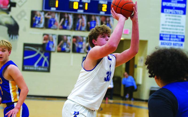 Beau Patterson prepares to shoot. The sophomore has fit like a glove in his first varsity season. HUNTER KING | DISPATCH RECORD