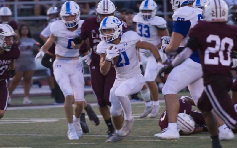 Ethan Moreno runs through the middle against Brownwood in week one. HUNTER KING | DISPATCH RECORD
