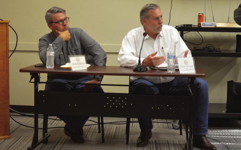 At left, House District 54 Rep. Brad Buckley (R-Salado) and District 68 State Rep. David Spiller (R-Jacksboro) listen as numerous KWSC users voice their concerns about the water quality. ERICK MITCHELL | DISPATCH RECORD