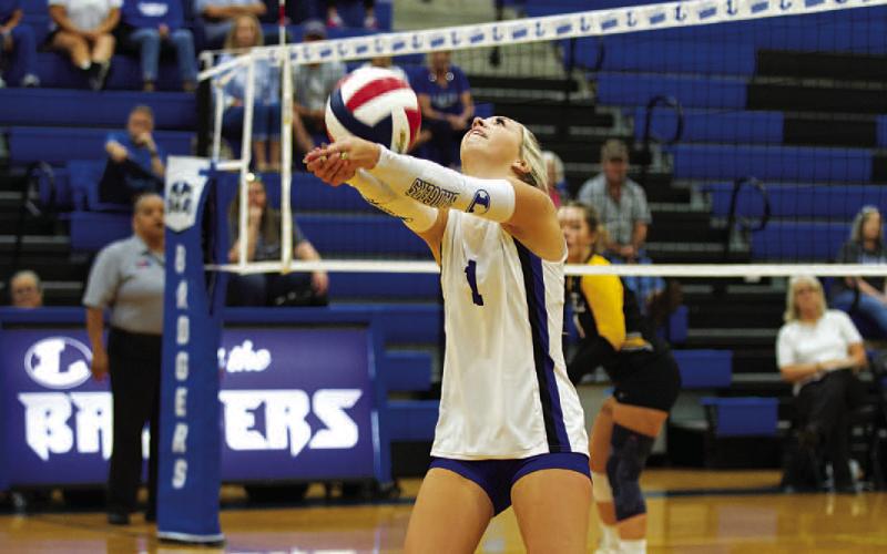 HUNTER KING | DISPATCH RECORD Brailey Wilson bumps the ball over her head in the third set against Gatesville.