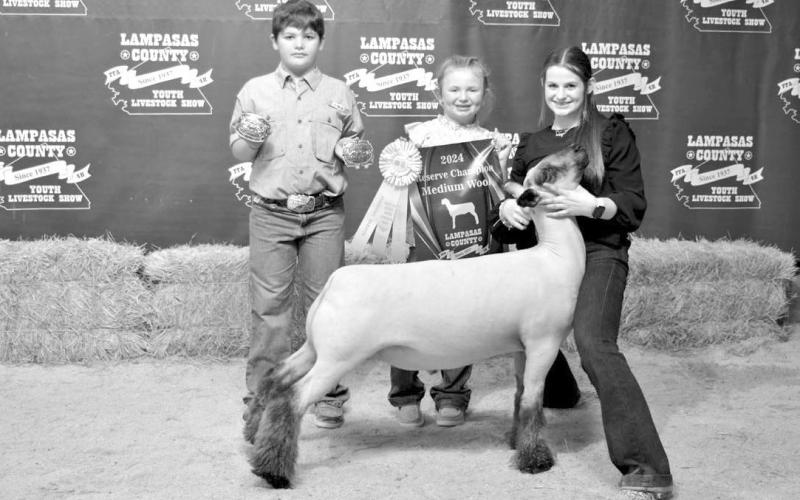 Tatum Duncan, at right, had the reserve champion market lamb this year. She also took home the sheep senior showmanship award. ERICK MITCHELL | DISPATCH RECORD