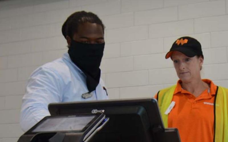 Since Whataburger opened its doors in Lampasas, the business has seen strong support from residents, customers and employees, according to lead manager Maurice Williamson, left. Pictured with him is employee Jodi Strickland. MONIQUE BRAND| DISPATCH RECORD