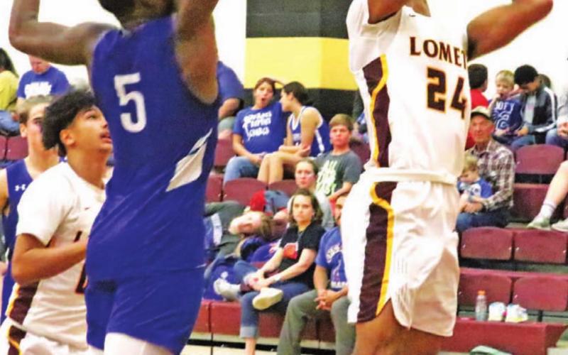 Dyllen Workmon goes up for a layup during the home tournament last week. JESSICA MALDONADO | DISPATCH RECORD