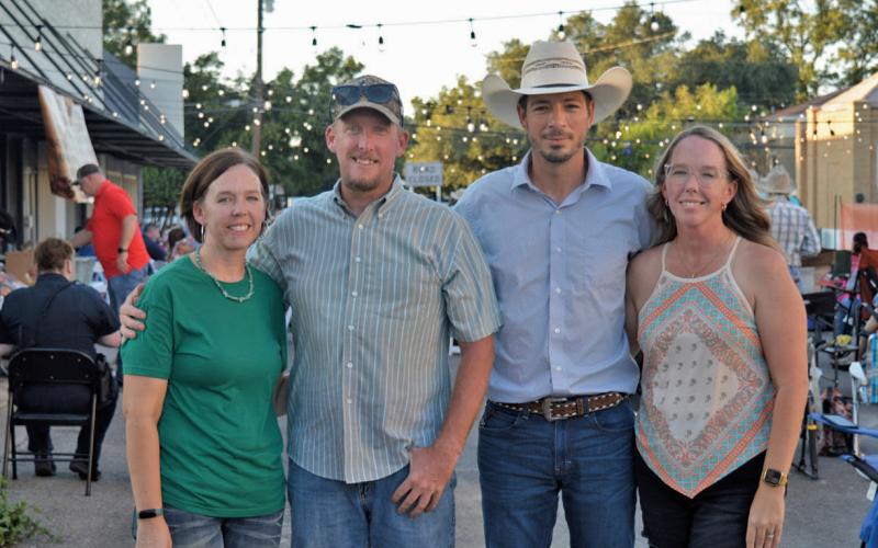 From left to right: Amanda Honea, Ross Honea, Stan Almazan and Jacque Almazan pose for a photo before Western Night on Western activities get underway. erick mitchell | dispatch record