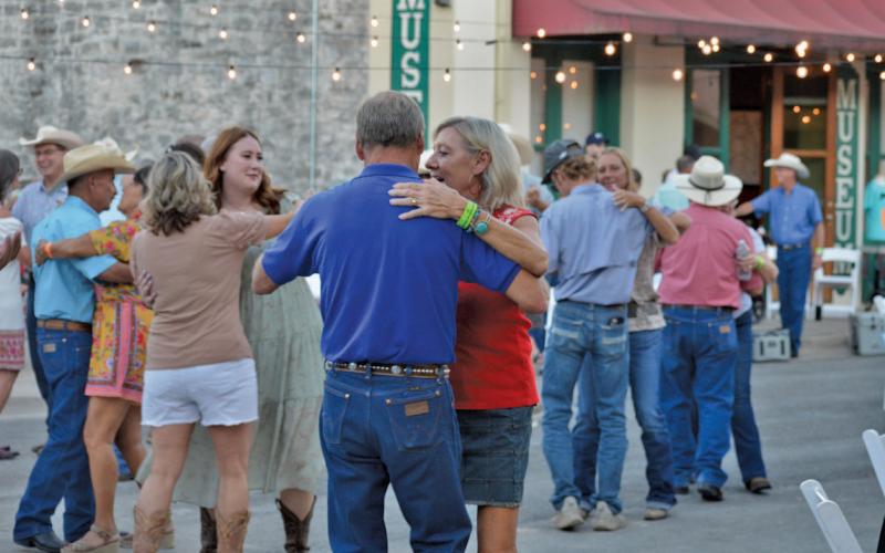 Couples fill an open dance floor during the Western Night on Western street dance held Saturday. erick mitchell | dispatch record