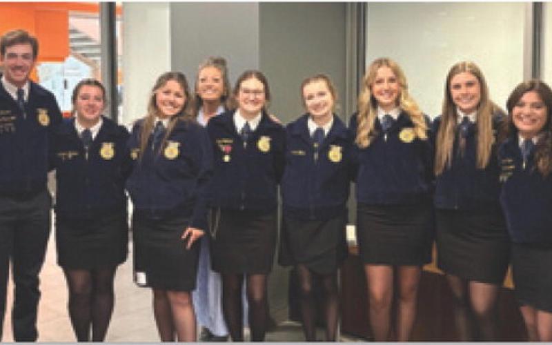 The Lampasas FFA Agriculture Sales and Farm/Agribusiness Management teams pose for a photo at the state competition at Sam Houston State University last month. COURTESY PHOTO