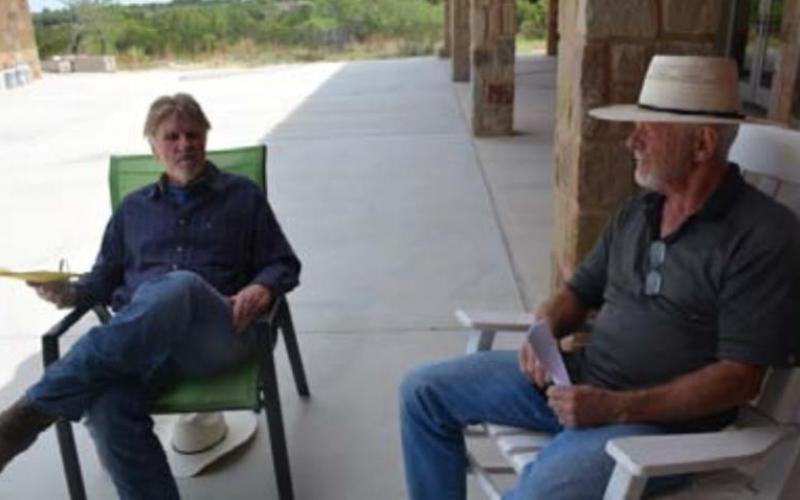 Ken Halpert, at left, and Dan Christy talk about their concerns with a proposed solar farm and tax incentives that might be offered for the project. MONIQUE BRAND | DISPATCH RECORD